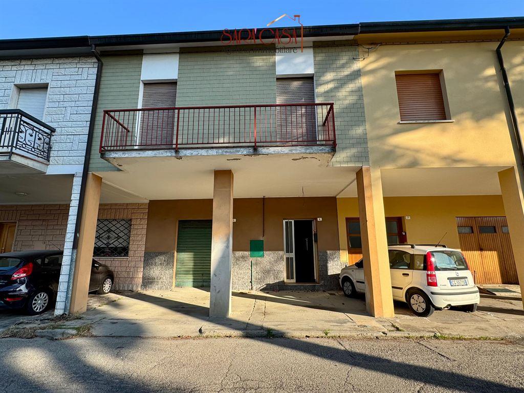 PORZIONE DI CASA DISPOSTA SU DUE LIVELLI CON CORTE PRIVATA E GARAGE