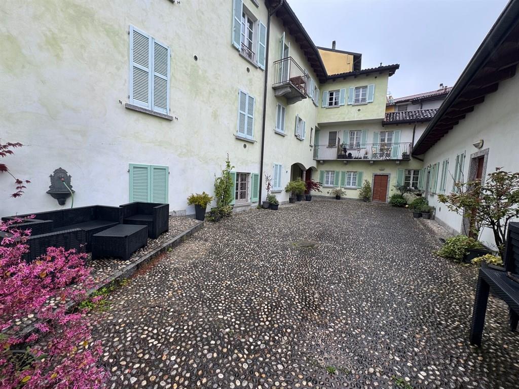 Lecco vendesi ampio monolocale con giardino e posto auto
