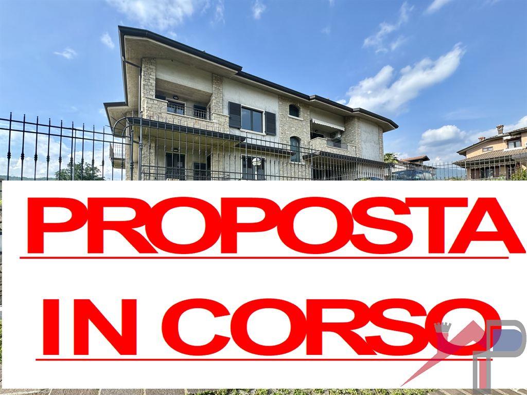 Ampio quadrilocale con giardino privato