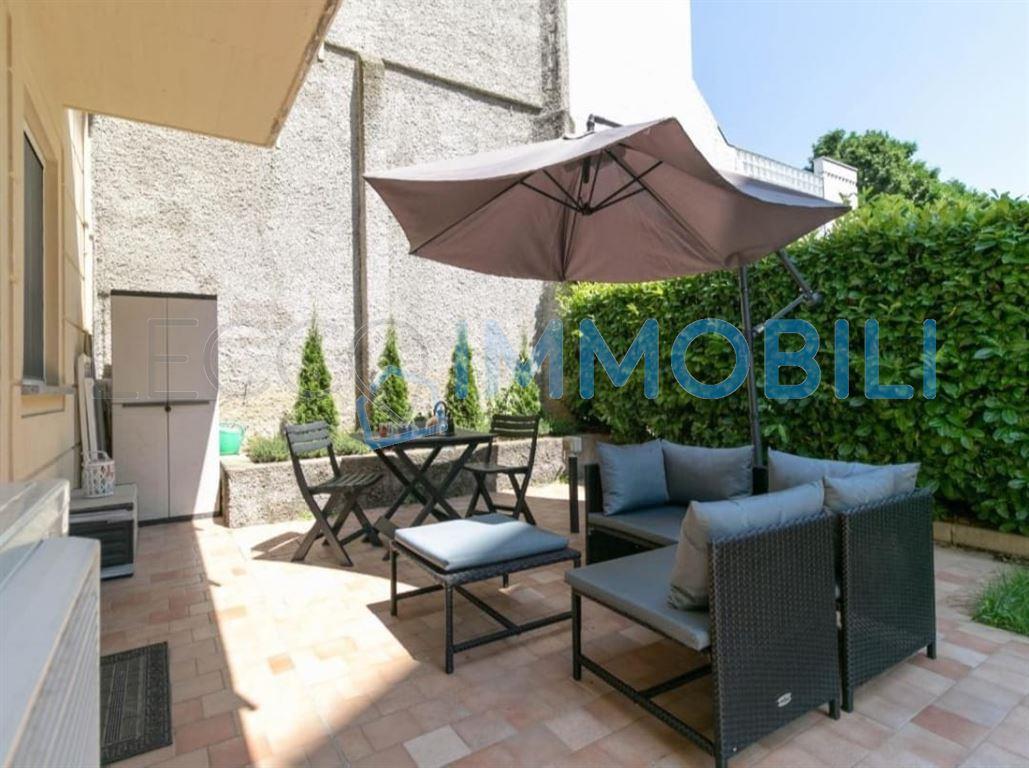 BILOCALE CON PATIO E GIARDINO