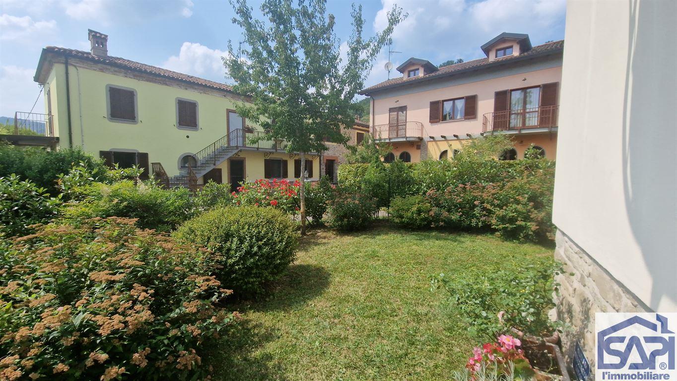 BILOCALE CON GIARDINO PRIVATO IN RESIDENCE