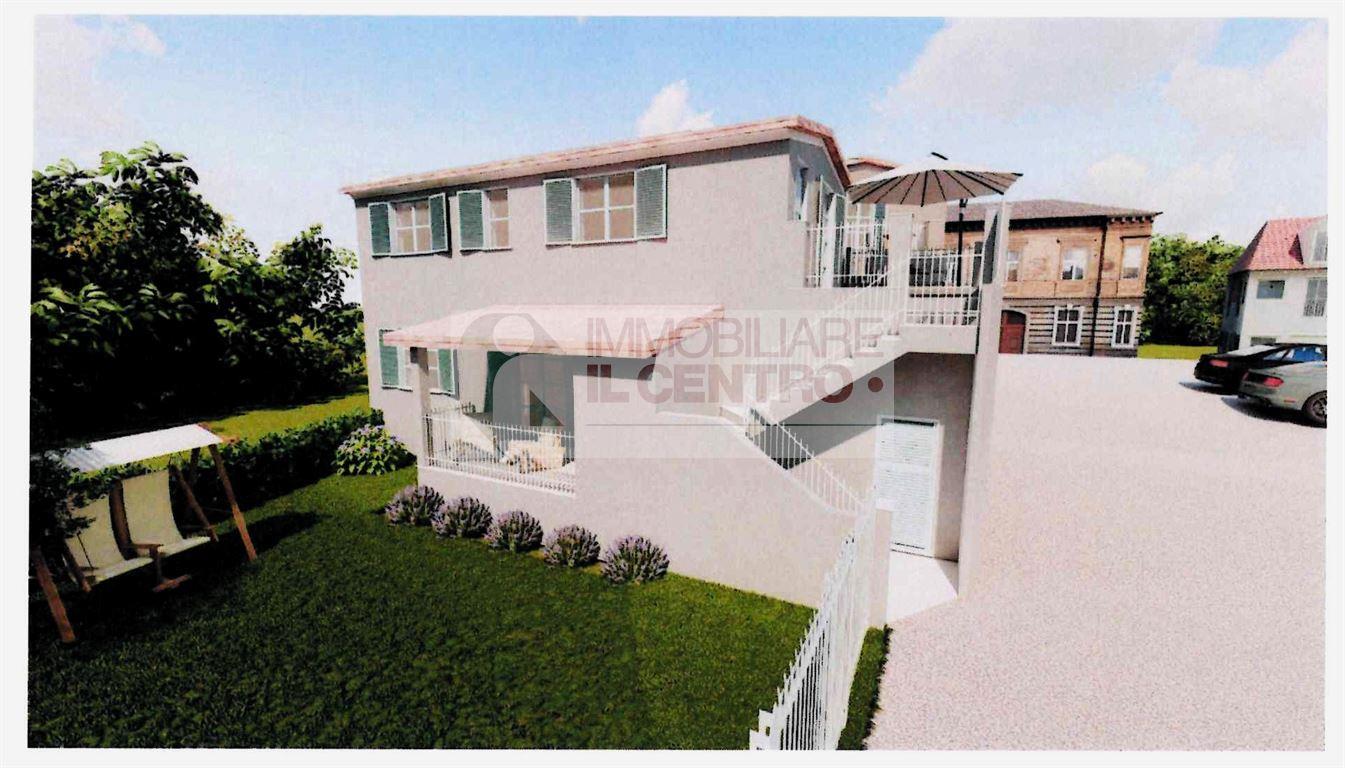 APPARTAMENTO CON GIARDINO E POSTO AUTO