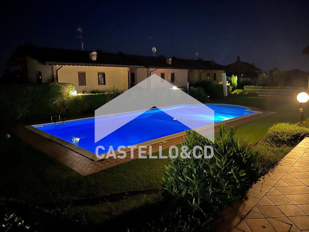 Bilocale SIGNORILE con giardino e piscina